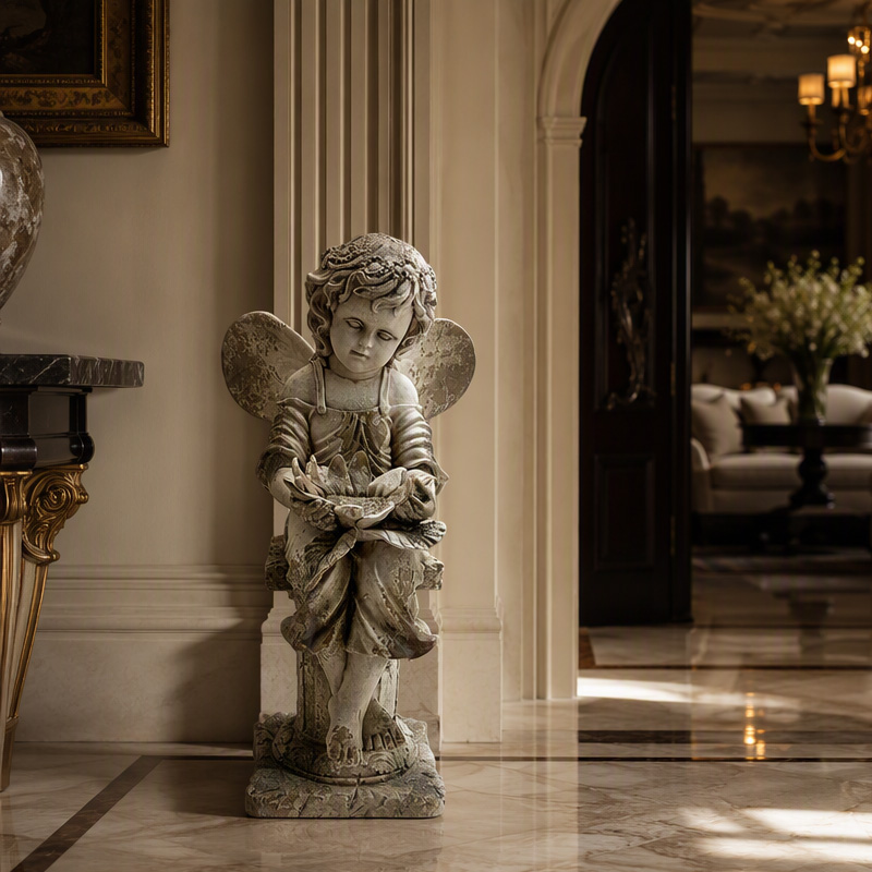 Stately Sitting Cherub with Flower
